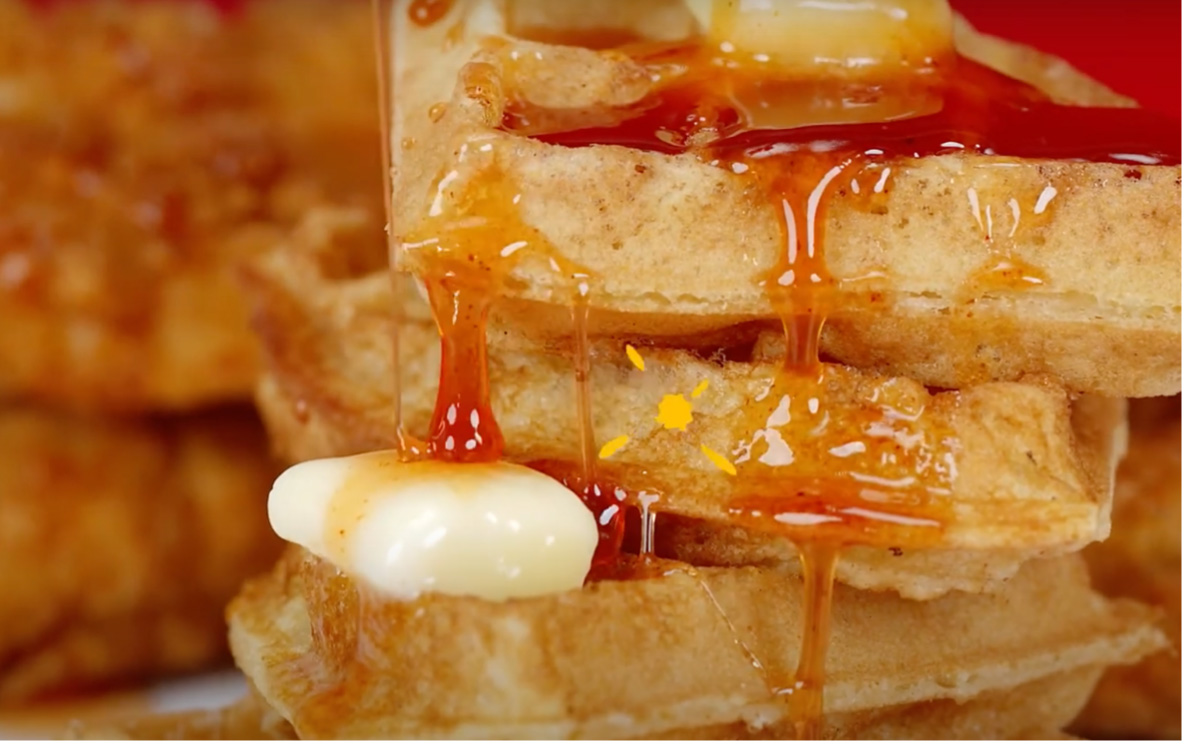 stack of waffles with butter and hotter hot honey drizzle